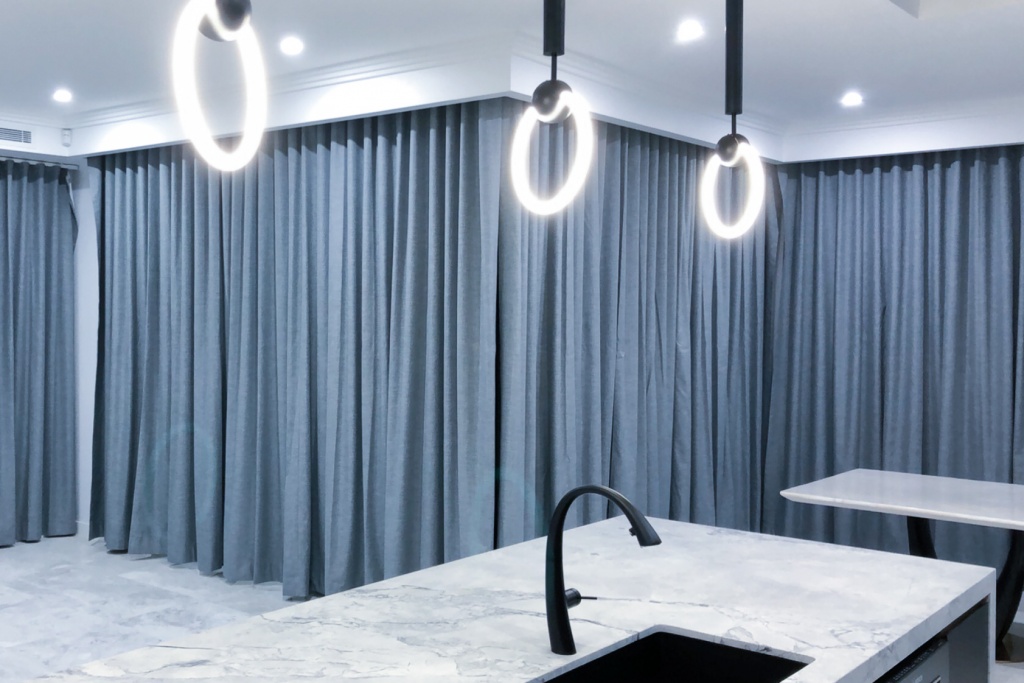 Elegant curtains that are grey coloured shown in a Unique Blinds project within a Sydney home.