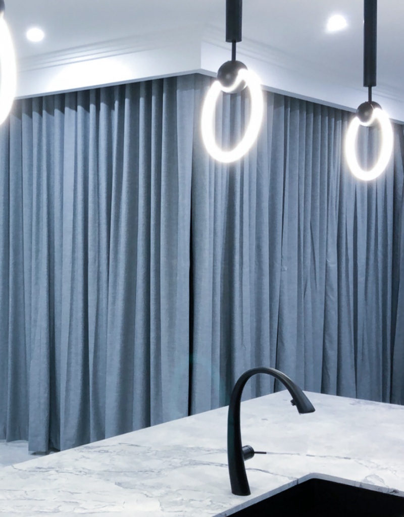 Curtains Elegant curtains that are grey coloured shown in a Unique Blinds project within a Sydney home.